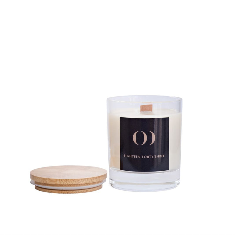 Candle with a wooden lid on a white background